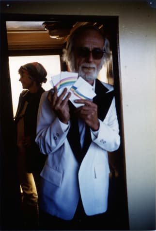 Robert Watts with rainbow cards (Photo: Geoffrey Hendricks, 1985)
